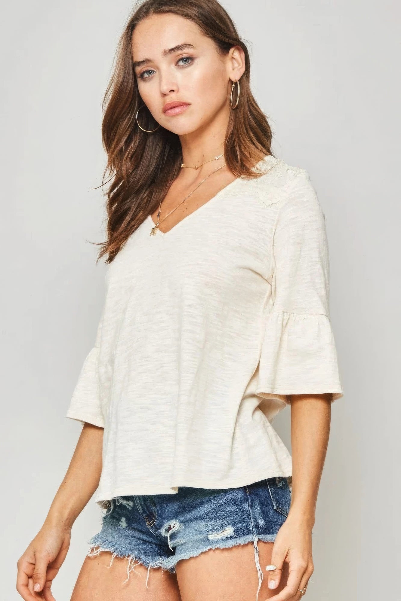 A Knit Women Top With Deep V Neckline And Yoke Design