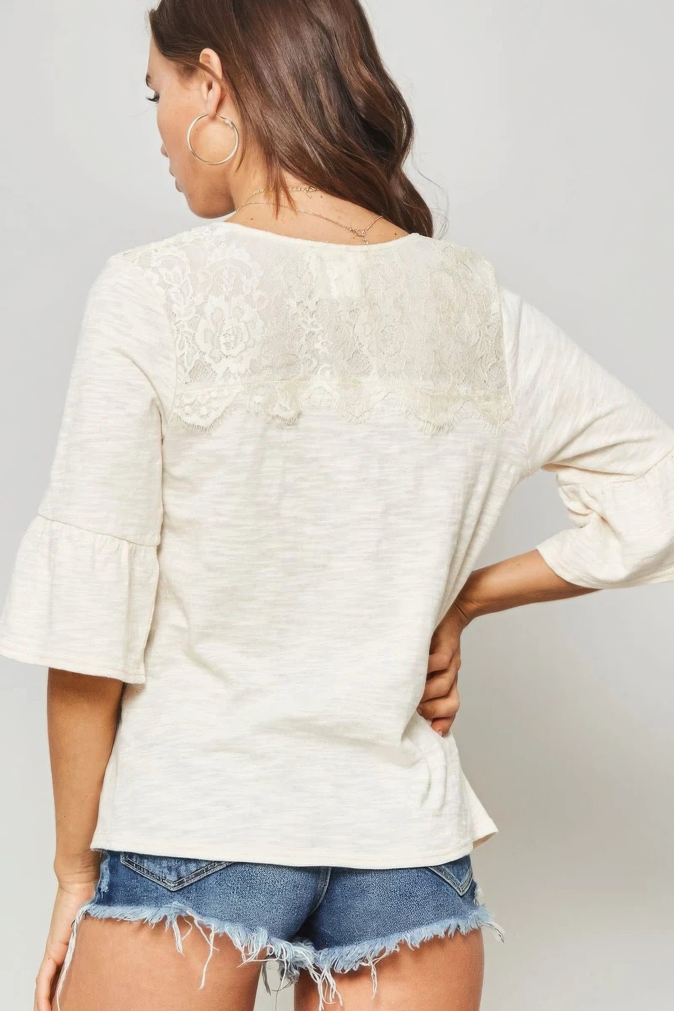 A Knit Women Top With Deep V Neckline And Yoke Design
